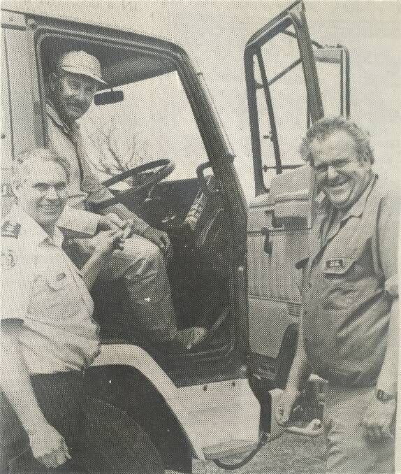ACQUISTION: St Helens CFA members Bruce Furnell and Max Humphries along with Belfast group officer David Wright get a look at the new truck in 1989. 