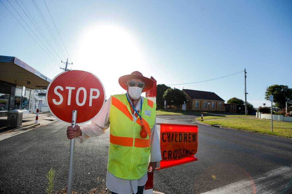 ON THE JOB: Trevor Dowie at his school-crossing posting this week. Picture: Anthony Brady