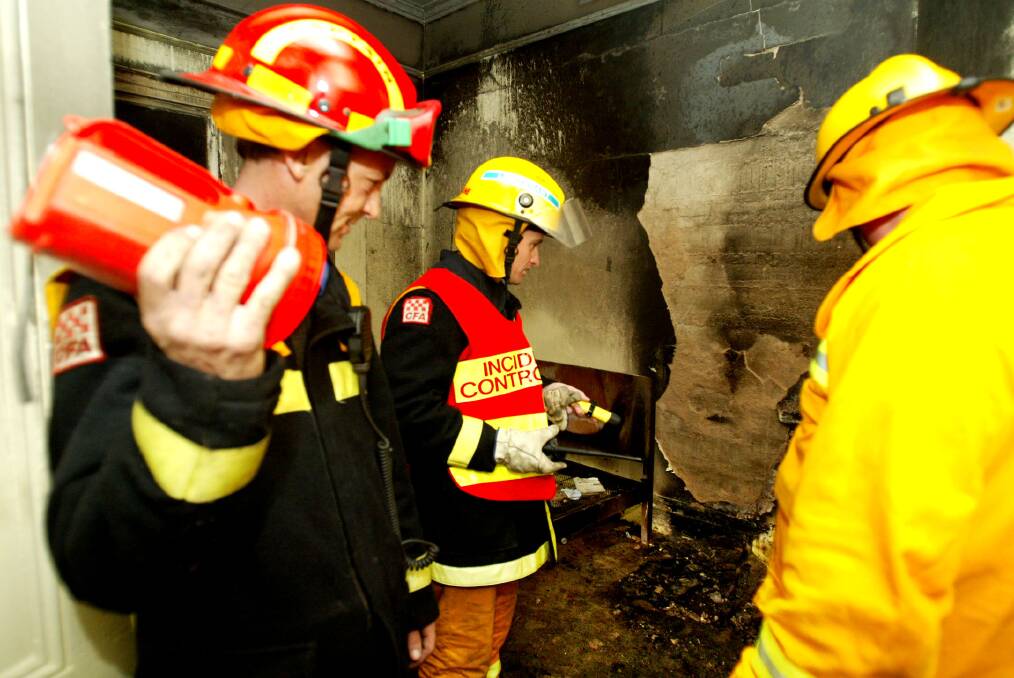 REWIND: Koroit CFA member Danny Keane checks out the damage to Shamrock House in Crossley back in 2004. 