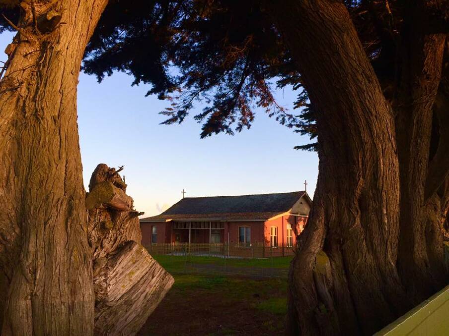 GONE: The Illowa Hall when it was surrounded by cypress trees.