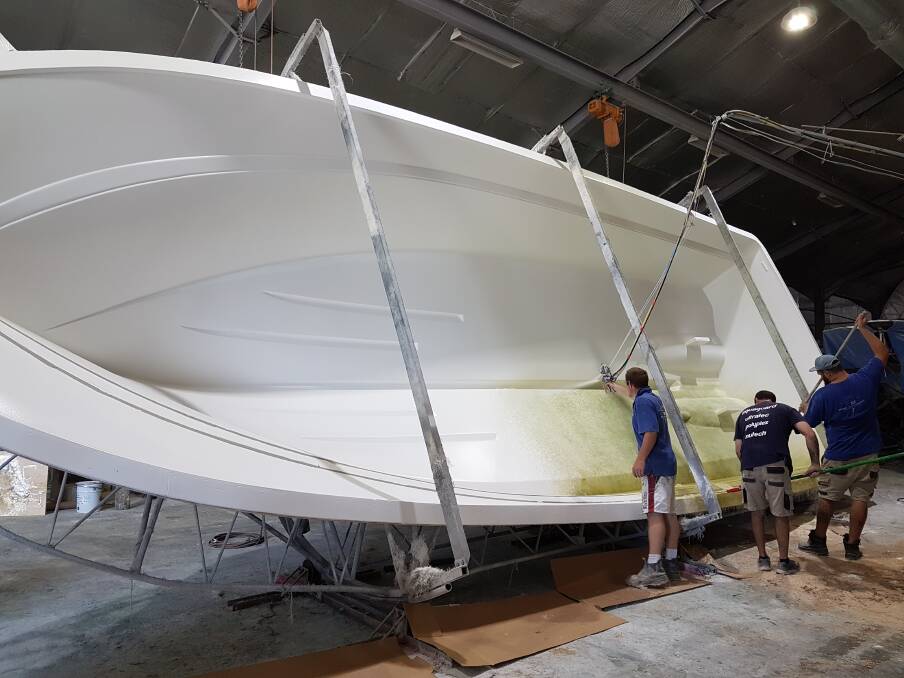 UNDER CONSTRUCTION: Workman continue the task of building the new vessel for the Port Fairy Marine Rescue Service. The new boat is expected to arrive in town in September.