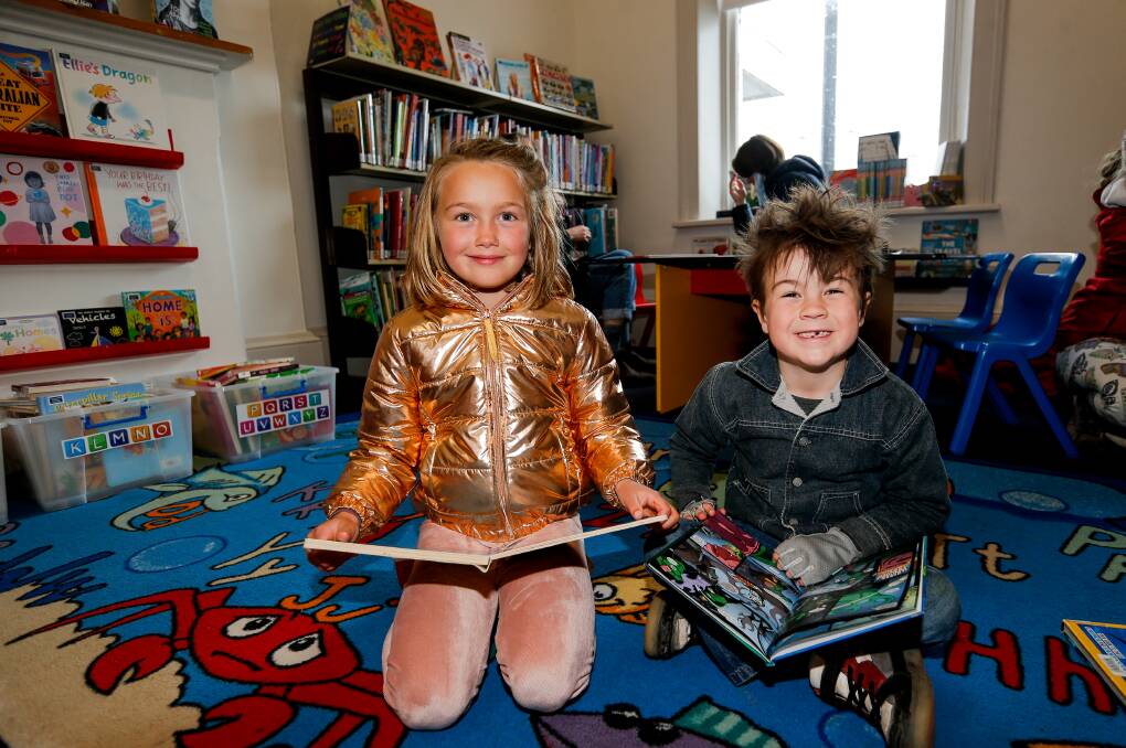 WELL READ: Warrnambool children Elia Pendergast and Gabriel Turner, both 6, at the Port Fairy Library. Picture: Anthony Brady