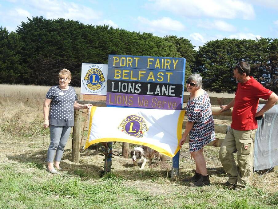 THANKS: Lions District Governor Biddy Weel helped Joy and John Errey unveil the new sign at their farm in Cobrico, near Cobden, in front of Port Fairy Belfast Lions Club members. Picture: Kim Kent