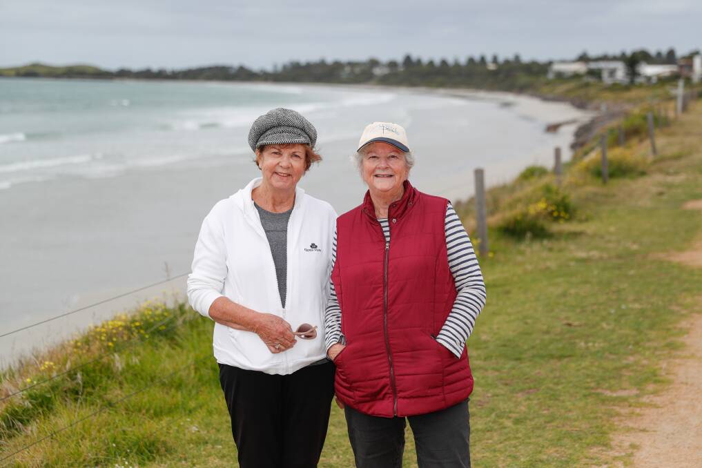 OUT FOR A WALK: Port Fairy's Kerrie Robertson and Sue Goy enjoying a stroll at East Beach. 