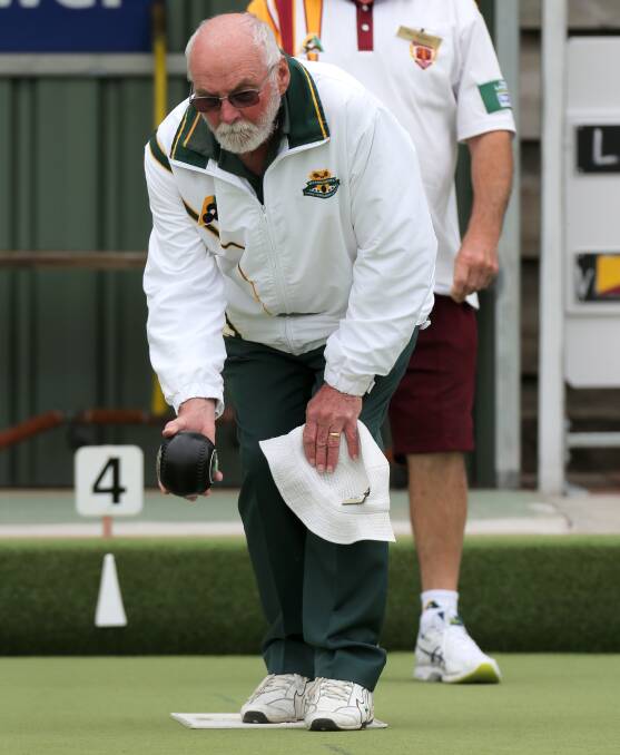 FOCUS: Lawn Tennis Red's Ian Prout lines up his bowl against Timboon Gold on Saturday. Timboon Gold won the game. Picture: Rob Gunstone
