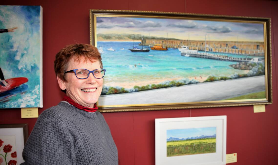 PICTURE PERFECT: Warrnambool and District Artists Society member Susanne Wallace at the annual art show, which is on daily from 12 noon to 4pm.