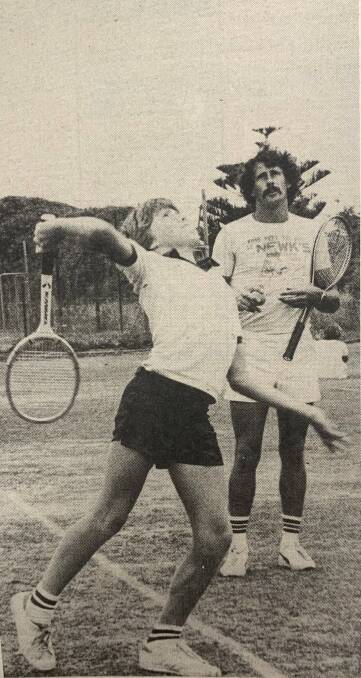 A HIT: Adrian Gleeson from Southern Cross reaches for a serve on the tennis court.