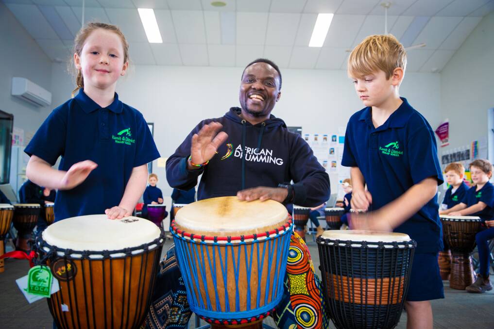  Koroit District Primary School students Elsie Tolson and Lawson Coffey with African drummer Kofi Nortey. Picture by Sean McKenna