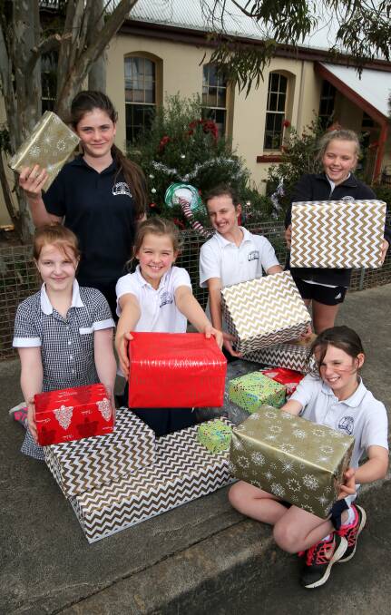 GIVING: Woodford Primary School pupils Jemma Stephen, Niamh Stoddart, Mia Malseed, Millie Shiells, Eavie Kelly, and Annabelle Barker. Picture: Rob Gunstone
