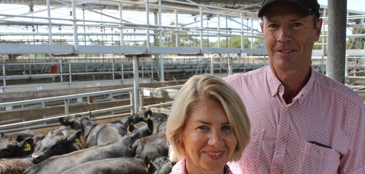 Happy: Jacinta and Michael Coffey, Port Fairy, gained 396-371c/kg for EU-accredited steers at the Hamilton weaner sale on Monday.