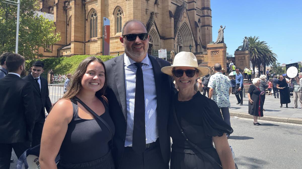 Vanessa and Greg Bookallil and their daughter Claire were there to honour Cardinal George Pell. Picture by Nadine Morton