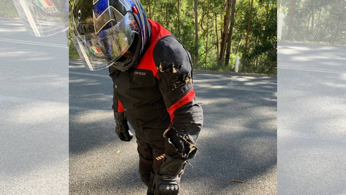 Robert Isherwood's protective motorcycle clothing was ripped and his helmet visor scratched from where he hit the ground after driving through a pothole repair. Picture supplied