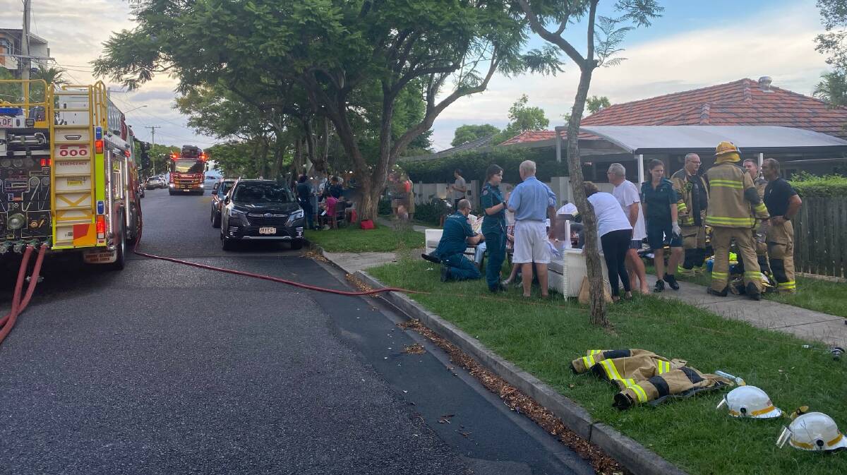 A makeshift triage centre was set up on the footpath near the burning apartment building. Pictures by Queensland Ambulance Service