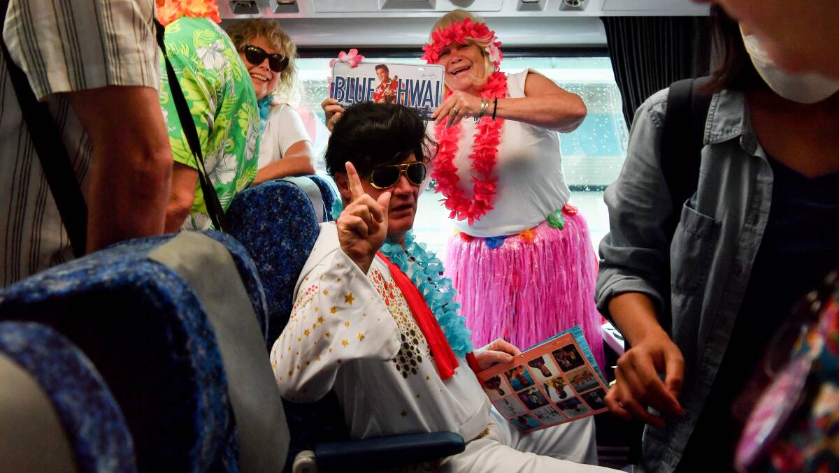 Fans dress up as Elvis Presley in the style of his movie Blue Hawaii as they wait for the departure of the Elvis Express train at Central Station in Sydney. Picture by AAP Image/Bianca De Marchi