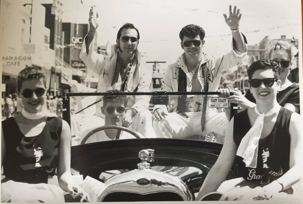 One of the few floats in the first Parkes Elvis (Revival) Festival street parade in 1993, and perhaps the most famous, with a 17-year-old Tiffany Steel (left); her brother Andrew Steel driving their father's vintage car; Elvis look-a-like winner, then Steve, now Elvis Lennox; sound-a-like winner John Lovett, Fiona Lovett (obscured) and Angelique Symington. Published in the Parkes Champion Post on January 13, 1993.