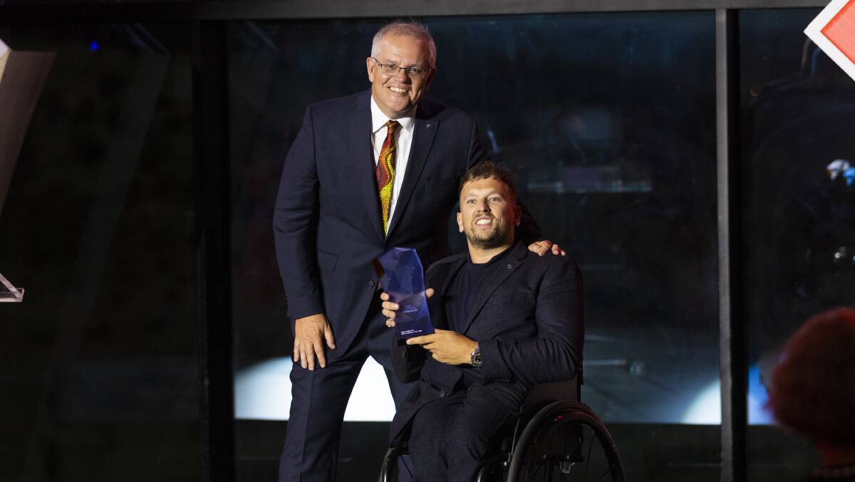 Prime Minister Scott Morrison awards Dylan Alcott the Australian of the Year honour. Picture by Keegan Carroll