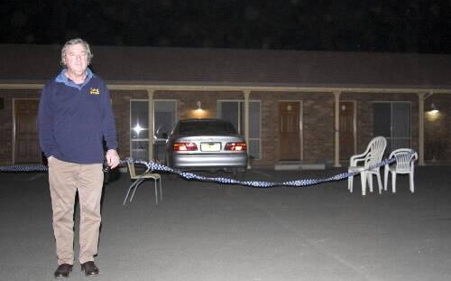 Motelier and former Yambuk man John Whitehead in front of the murder suspect's car. Pictures: FAIRFAX