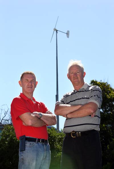 Port Fairy residents Allan Hadden (left) and Paul Cross are upset with the location of Port Fairy Consolidated School's wind turbine.