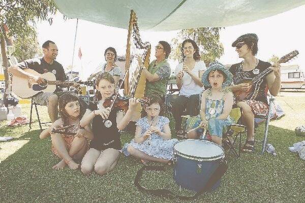 The Belfrage family jams together at the Koroit Caravan Park yesterday. Niall Quiery (left) and Mary, Jane, Lucy and Abigail Belfrage and children (front) Dervla, Mabel, Angie and Laura Belfrage are taking part in the Lake School of Celtic Music, Song and Dance. 090104GW26 Pictures: GLEN WATSON  Adelaide's Jack Brennan and Nick Martin practise their uilleann pipes, the national bagpipes of Irelan