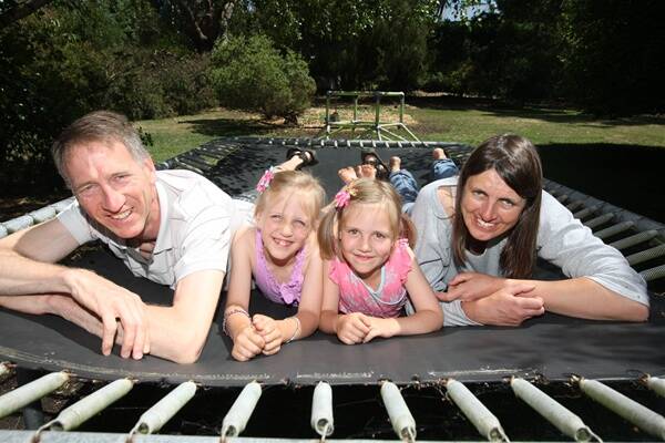 Warrnambool doctor Karoline Gunn (right) with family (l-r) Neil Holland, Nelly, 7, and Klara Holland, 6, take time out to relax ahead of their big move to a new life in the outback.
