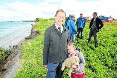 Matt Hayes visits Port Fairy's steadily disappearing East Beach dunes with Kiri Hawkes, 6. Mr Hayes and concerned residents are starting a community group to address the erosion problem.