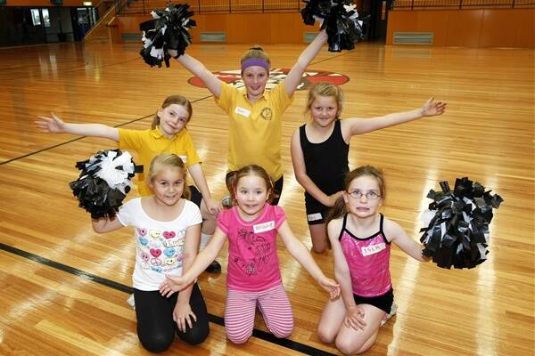 Tayla Forrester, 8 (rear left), Shannon Philp, 12, Amy Alexander, 10, Emma Sheppard, 7 (front left), Hanna Unwin, 5, and Isla Pleming, 7, take on the cheerleading challenge at classes that began yesterday in Warrnambool.