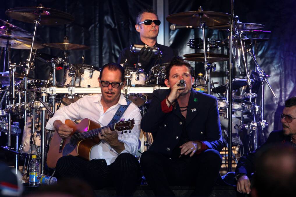Red Hot Summer Tour at Warrnambool Racecourse. Pictured is headlining act INXS, John Farriss (drums), Kirk Pengilly (guitar), and Ciaran Gribbin (vocals).   