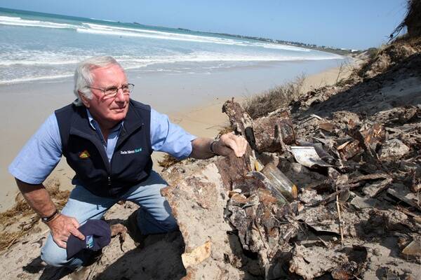 Port Fairy resident John Bade at the site of the old Port Fairy tip, which has been unveiled by erosion at East Beach.