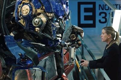 Optimus Prime comes face to face with Frances McDormand's government agent in the latest  Transformers  movie.