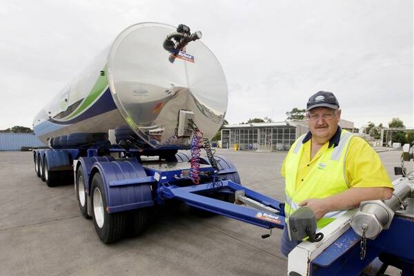 Ron Heard, driver and relief scheduler at Fonterra’s Cobden plant, with the A-double tanker — believed to be the only one operating in Victoria.
