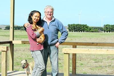 Geoff Tonks and his wife Yuan Fu are building a lookout on their property to give visitors a prime view of an adjoining wind farm, which they support in the area. 120404DW15 Picture: DAMIAN WHITE