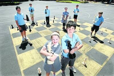 Warrnambool East Primary School chess whiz-kids Helen McMurrich, 12, and Riley McDonald, 11, (front) Oliver Love-Davies, 11, (back, left) Jai Timmer, 11, Michael Brittain, 10, Jasmine Kelly, 12, Tyler Jervies, 11, and Levi Mailes, 11, will display their moves at the Warrnambool show this weekend. 091029GW03  Picture: GLEN WATSON