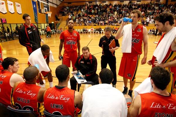 Melbourne Tigers coach Trevor Gleeson addresses his players in familiar territory at the Arc.