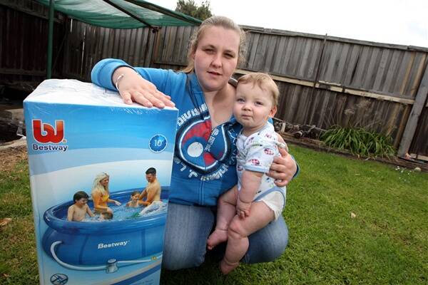 Warrnambool’s Jade Green, with her 8-month-old son Tyler Dowdell, bought inflatable pool from Kmart but the council told her she needs a fence and permit.
