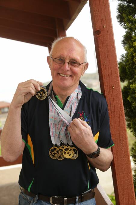 Masters swimmer Noel Ryan with his golden haul of six medals. 