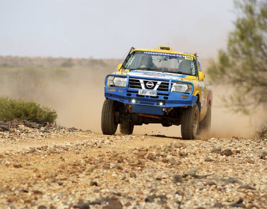 Driver Reg Owen and navigator Russell Cairns power through the outback in the Australasian Safari.  