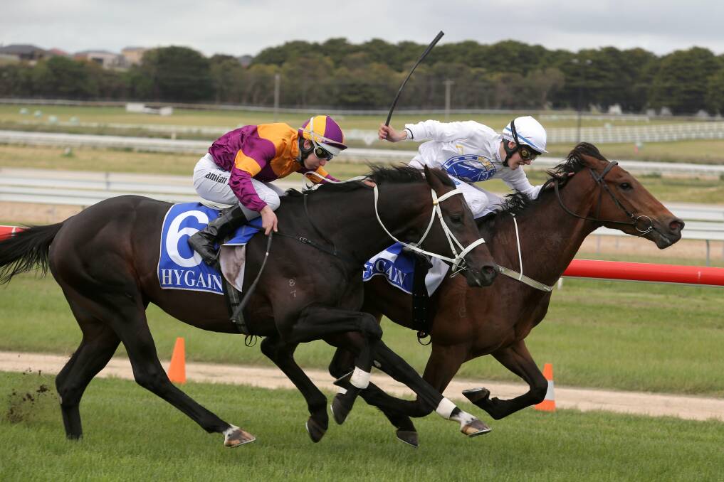 Jordan Childs onboard Angelology takes the lead on the rails from the Aaron Purcell-trained Single Warrior ridden by Damian Lane, to claim his first winner in the feature benchmark 72 handicap (1700m) at Warrnambool yesterday. 
