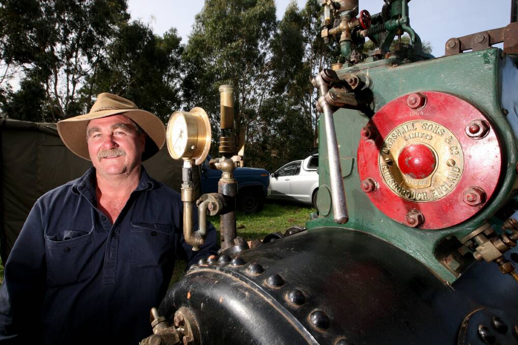 Warrnambool’s John Brown checks out a 1909 Marshall portable steam engine at the Laang Vintage Engine Rally. 
