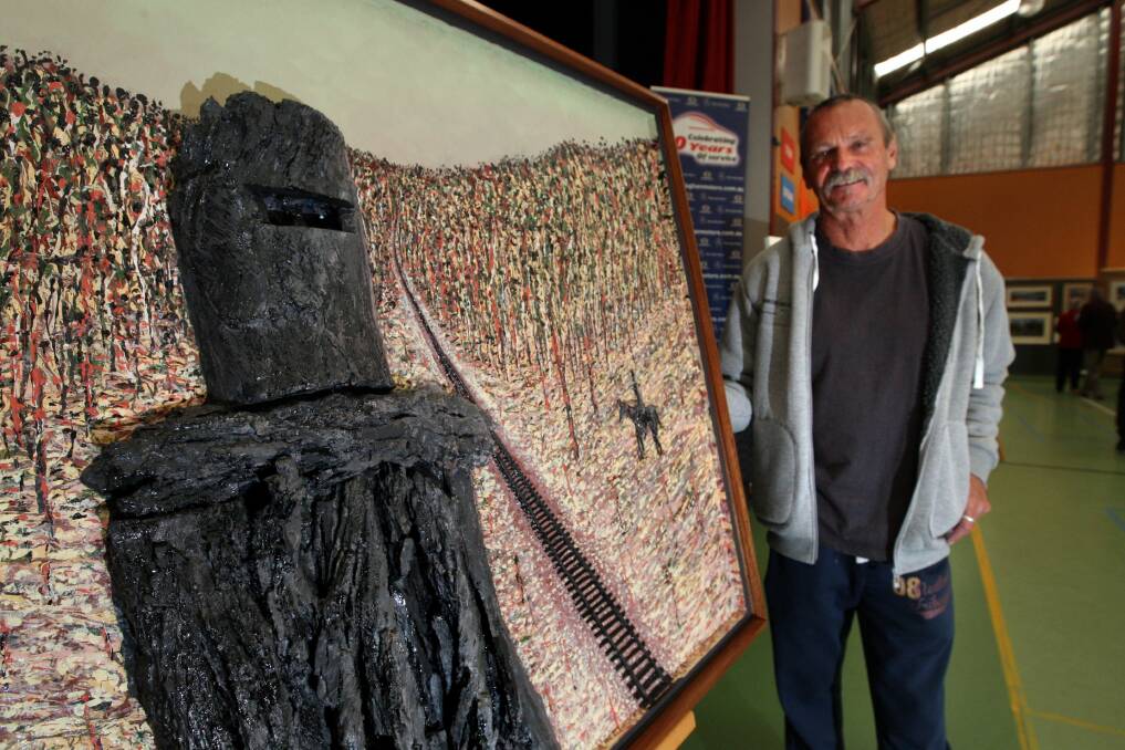 Trevor Holder with his prize-winning abstract work Ned Kelly, rail to Euroa. 