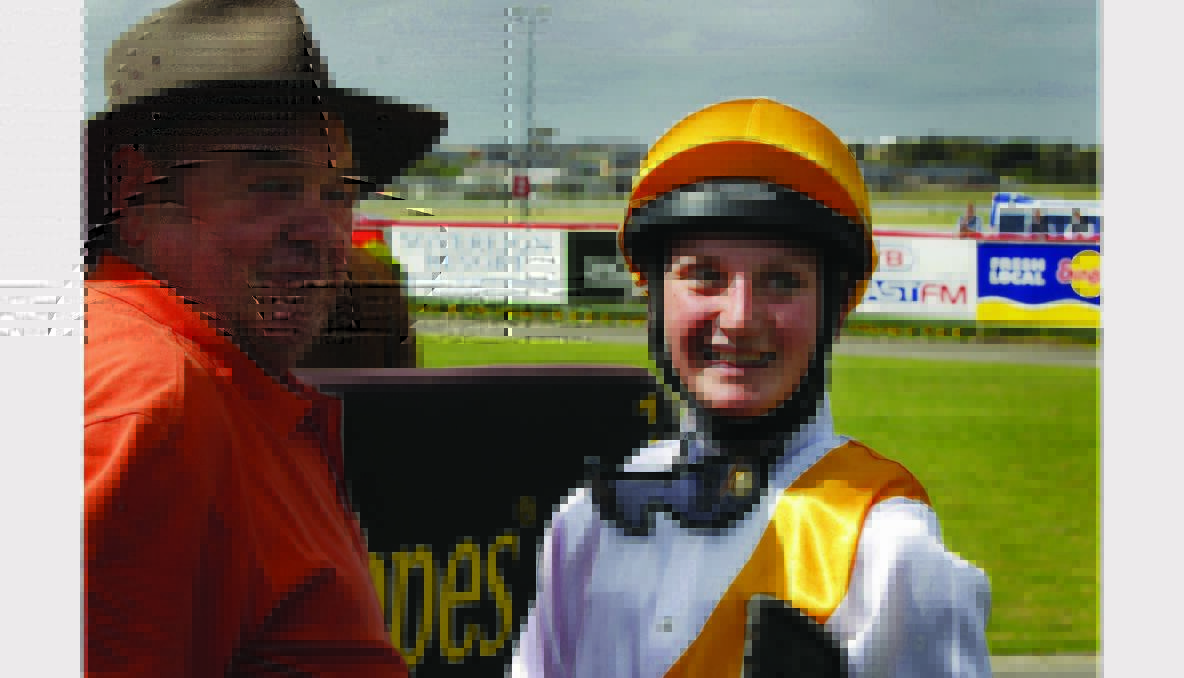 Trainer Ian Walker and wining jockey Jamie Kah, 16, after winning with Lionhearted Girl.