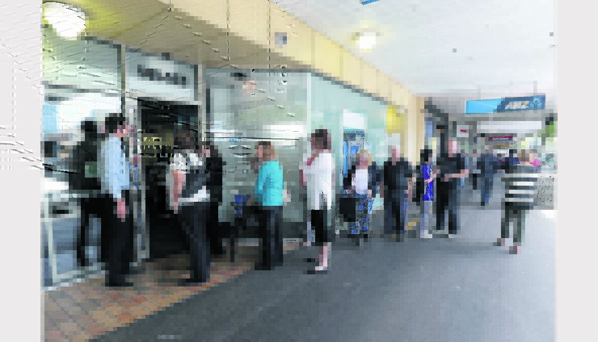 Next please: customers line up outside Warnambool's ANZ bank. PICTURE: DAMIAN WHITE.