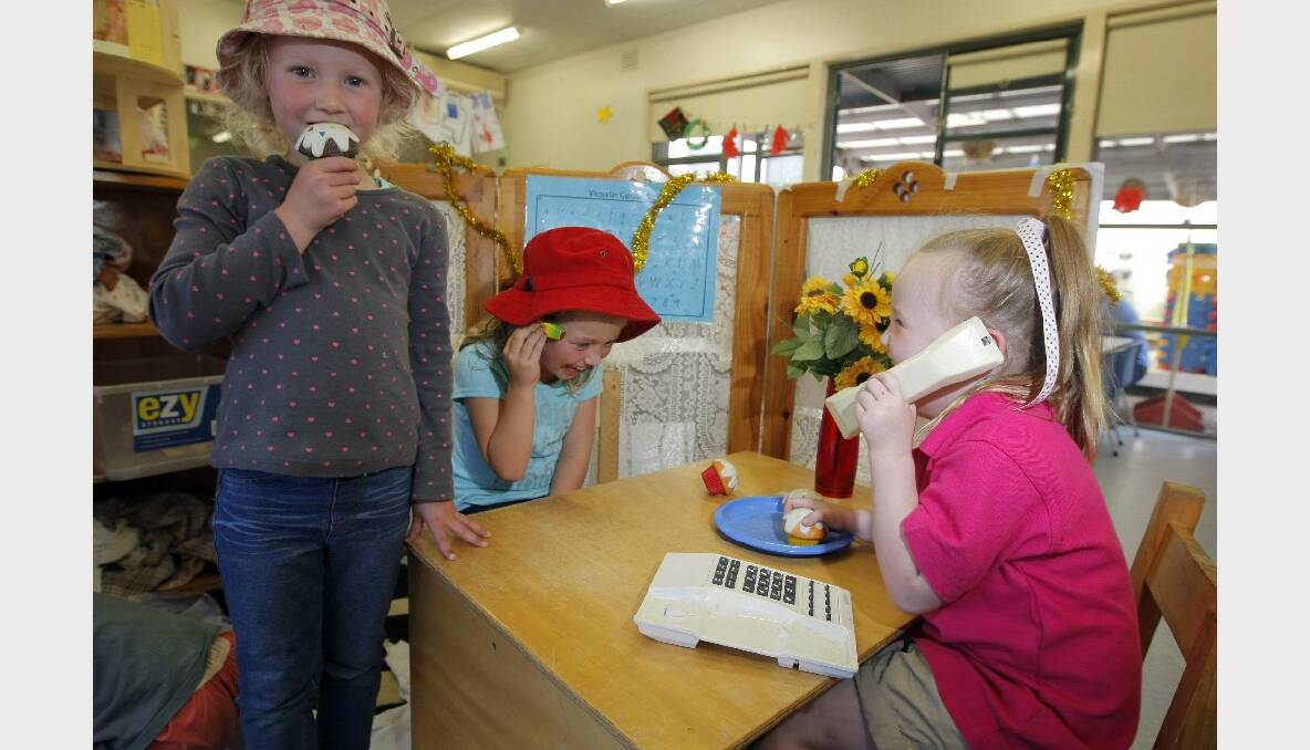 Hillary Hannigan, 5 (left), Mili-mai Campbell, 5, and Elle McDonough, 5, play with a telephone at the Florence Collins Childrens' Services Complex. Childcare services will run as normal during the electronic meltdown. PICTURE: ROB GUNSTONE.