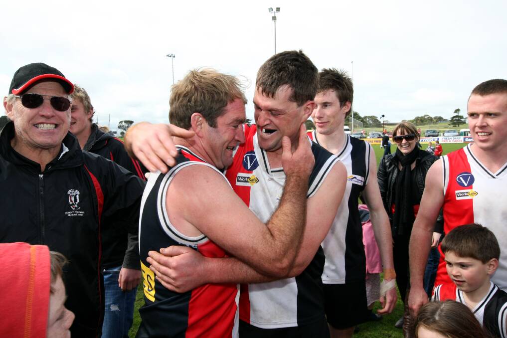 Koroit veteran Anthony Mahony (left) with teammate Simon Lenehan after the Saints won the 2010 HFNL reserves grand final — his final match with the club. 
