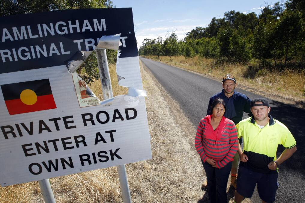 Vandalism or vendetta? Framlingham Trust members Kyeema Lovett (left), Possum Clark-Ugle and Coedie Carter-Clarke beside the road sign damaged by what is believed to have been a homemade bomb. 