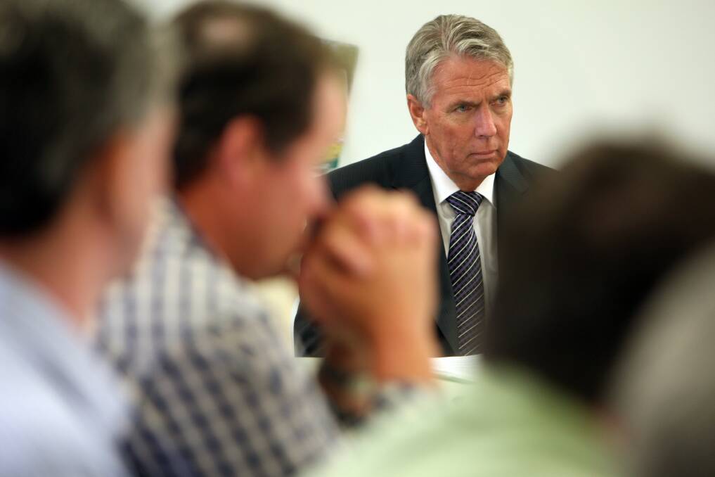 Victorian Agriculture Minister Peter Walsh listens yesterday.