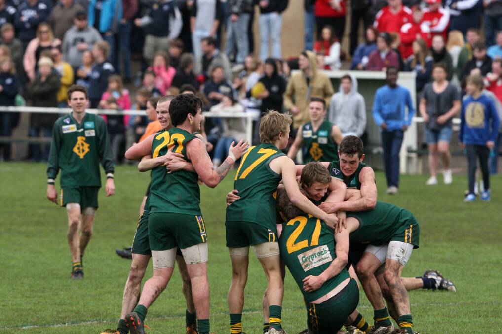 Jubilant Old Collegians U17½ players celebrate their grand final victory after finishing strongly against Allansford at Reid Oval. 