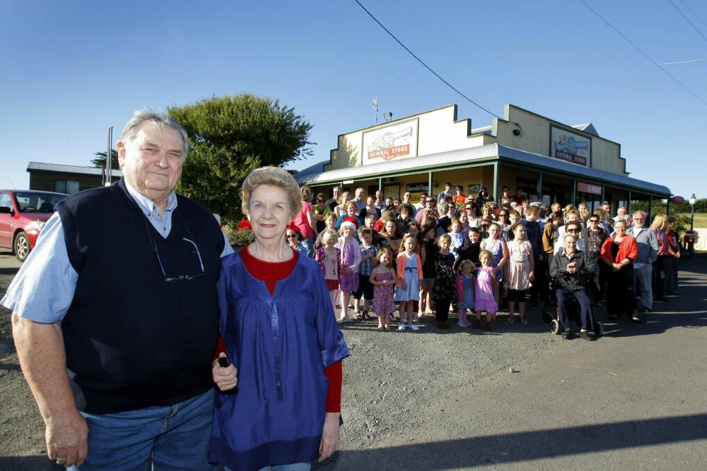 Wangoom General Store operators Les and Jill Trotter earn pride of place at the Wangoom Christmas party for their key role in maintaining local services to the community. They will relinquish the role early next year.