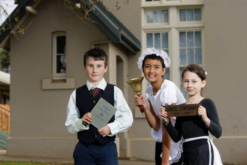 Cudgee Primary School pupils Reuben Knoll-Miller, 8, Rhiannah Maddocks, 11, and Molly Morrice, 8, dress the part for their school’s 150th anniversary celebrations. 