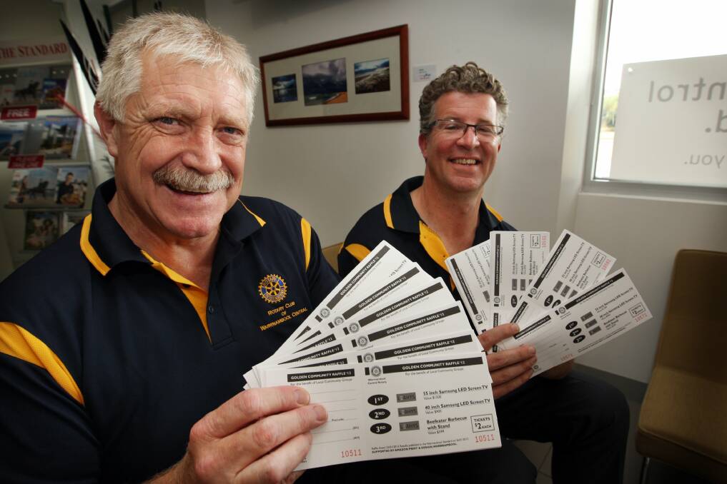 Central Rotary club’s Bob McMillan and Matt Northeast with the Golden Community Raffle tickets. 