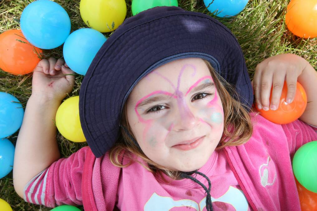  Port Fairy visitor Lucy Sanderson, 3, has a ball at the rejuvenated Penshurst show.